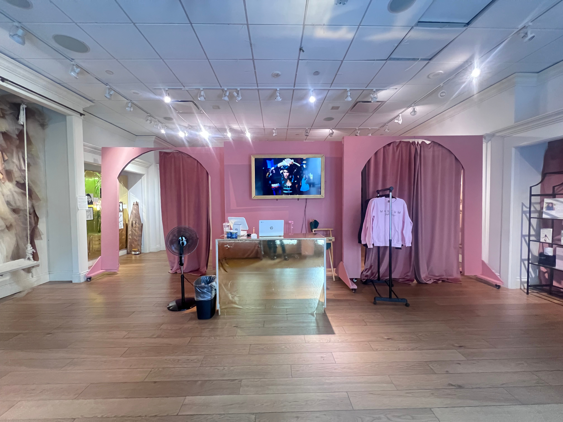 Pink archways and the museum boutique with rose-clay walls