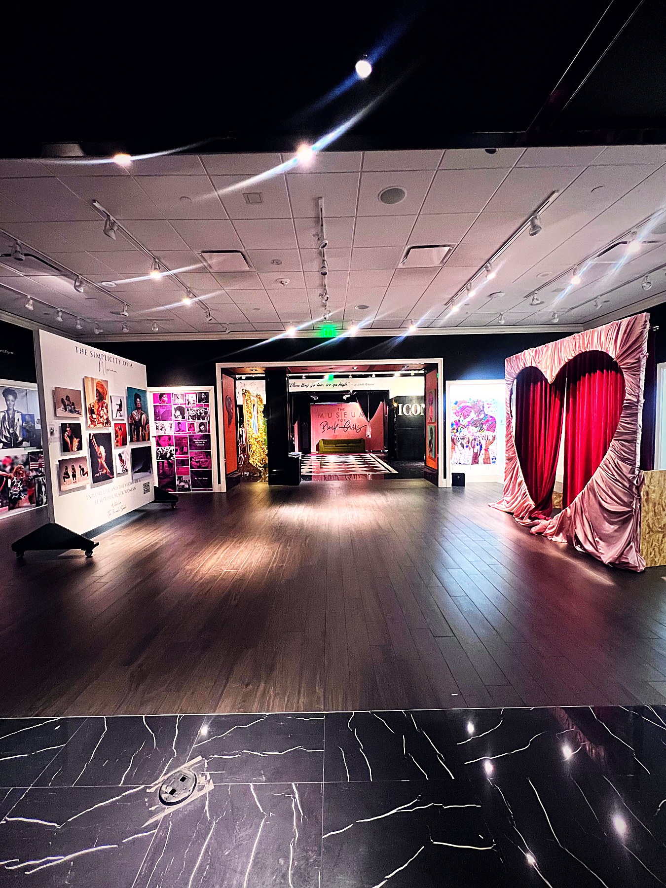 Wide view of the heart curtain installation leading into the ICON gallery at Museum for Black Girls
