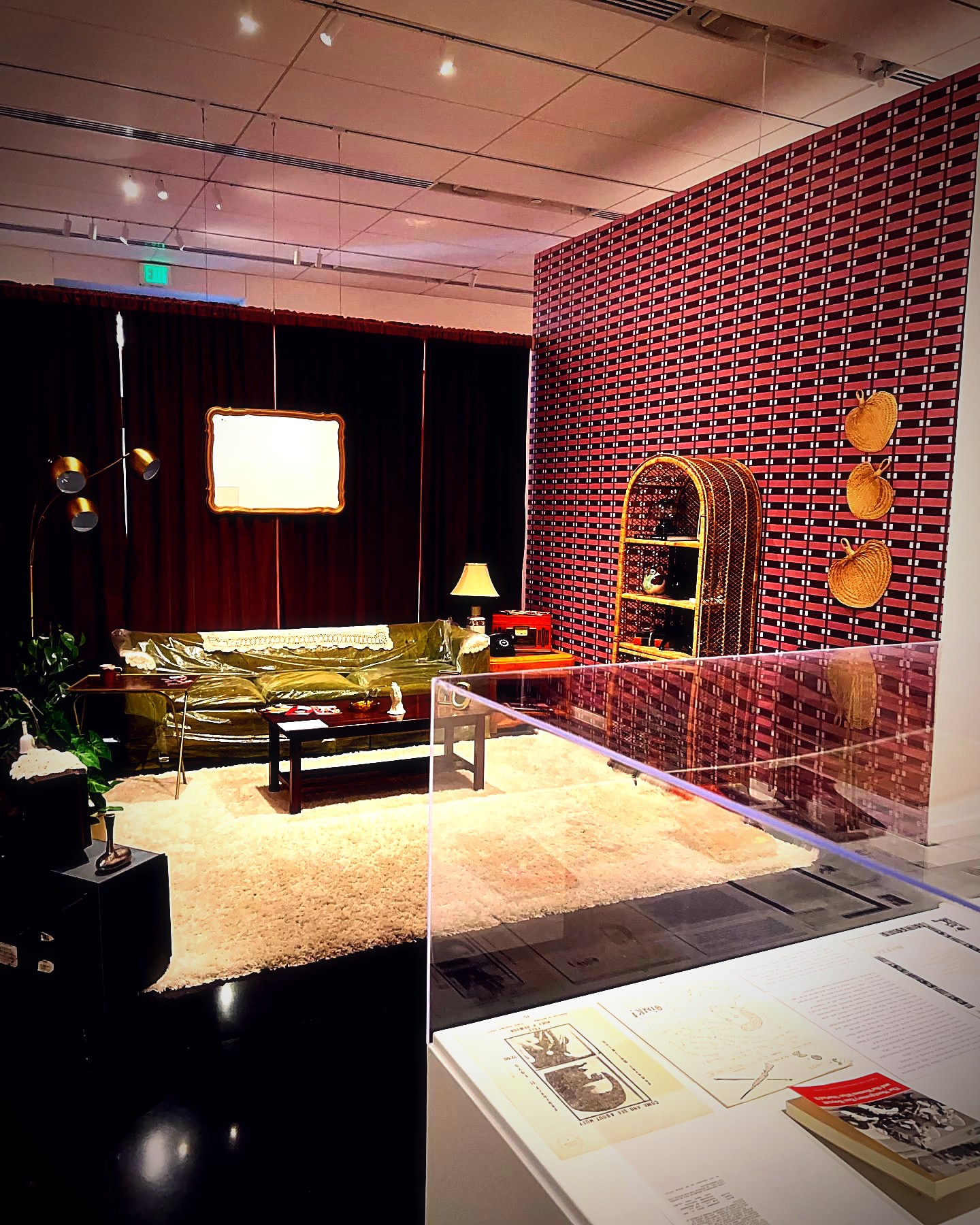 Green velvet lounge installation inside the Museum for Black Girls