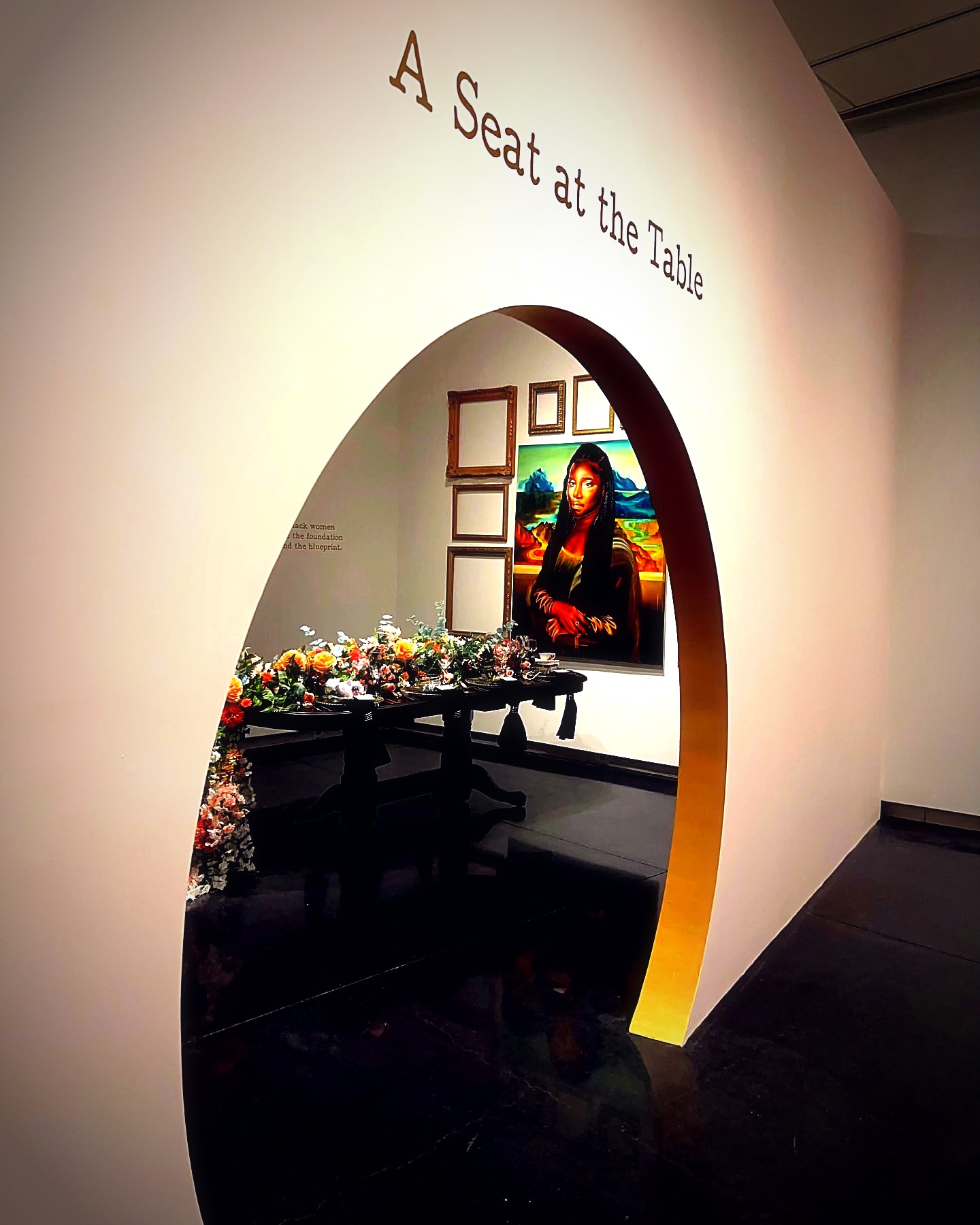Seating and tables set inside the galleries at Museum for Black Girls
